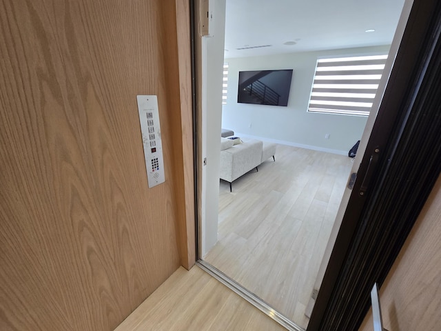 corridor with wood finished floors