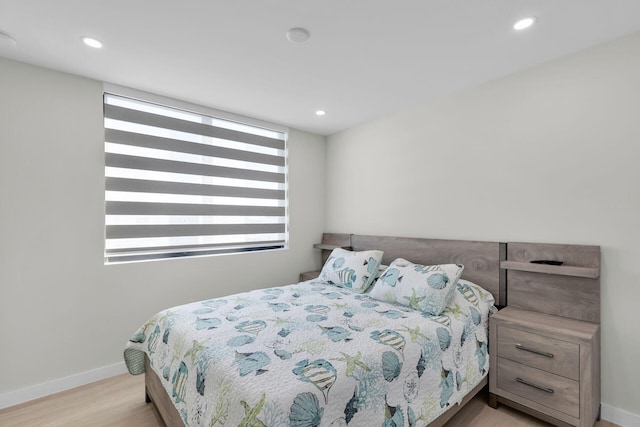 bedroom featuring recessed lighting, baseboards, and wood finished floors