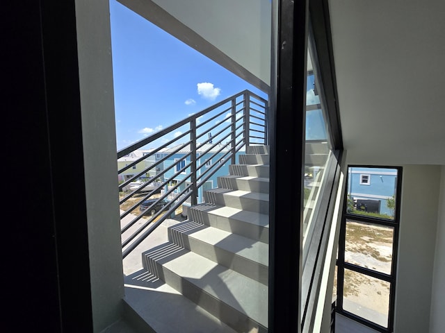 stairway featuring a healthy amount of sunlight