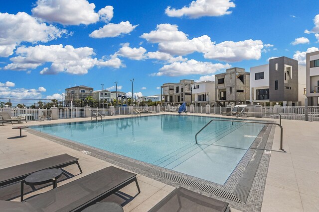 view of swimming pool featuring a patio area