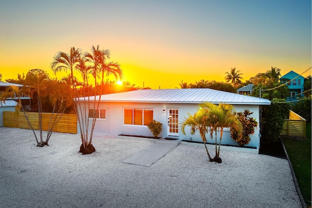 single story home featuring a patio area