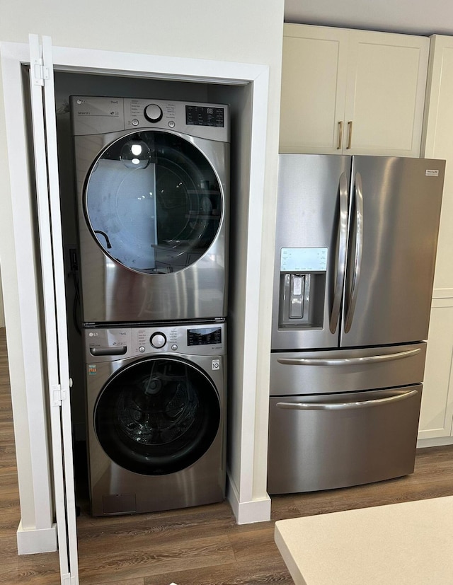 18 Palm Dr, Key Largo, FL 33037 - laundry area with stacked washer / dryer and dark wood-type flooring