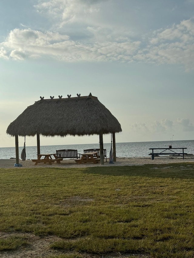 18 Palm Dr, Key Largo, FL 33037 - dock area with a water view and a yard