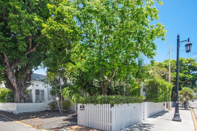 400 Aronovitz Ln, Key West, FL 33040 - exterior space featuring a fenced front yard, a standing seam roof, and metal roof