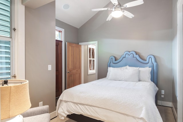 400 Aronovitz Ln, Key West, FL 33040 - bedroom with vaulted ceiling, baseboards, and a ceiling fan