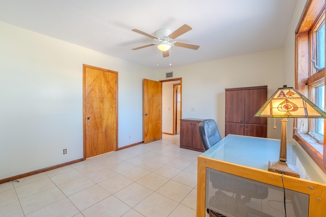 office featuring ceiling fan and light tile patterned floors