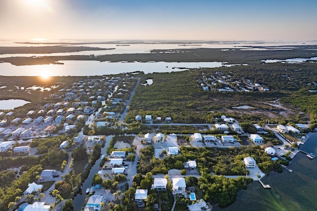 aerial view at dusk with a water view