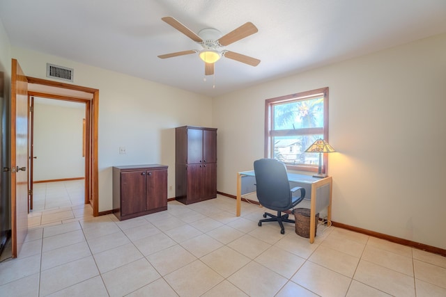 tiled office space with ceiling fan