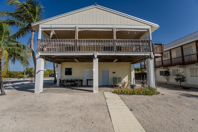 rear view of property featuring a patio