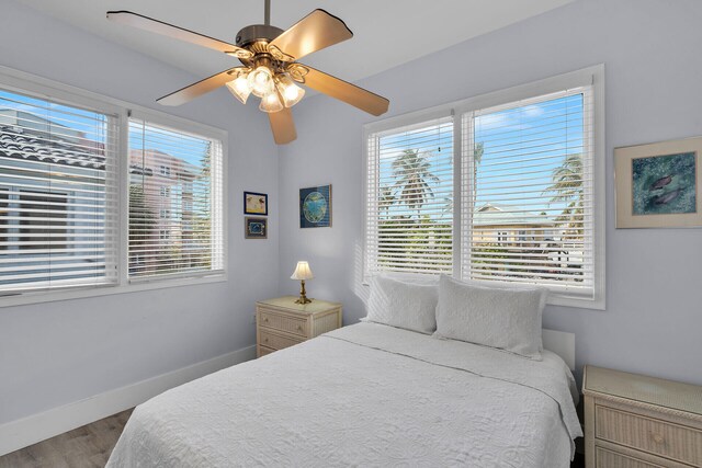 23 S Kyle Way, Marathon, FL 33050 - bedroom with multiple windows, wood-type flooring, and ceiling fan