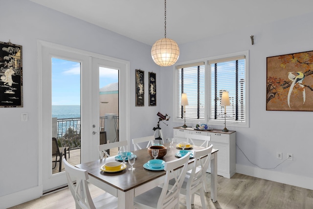 23 S Kyle Way, Marathon, FL 33050 - dining area with light wood-type flooring and a water view