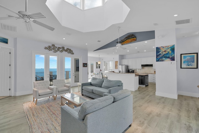 23 S Kyle Way, Marathon, FL 33050 - living room with a water view, ceiling fan, plenty of natural light, and light hardwood / wood-style floors