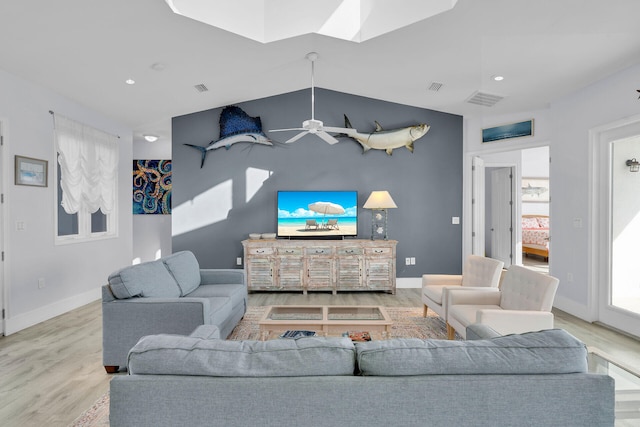 23 S Kyle Way, Marathon, FL 33050 - living room with ceiling fan, lofted ceiling with skylight, and light hardwood / wood-style floors