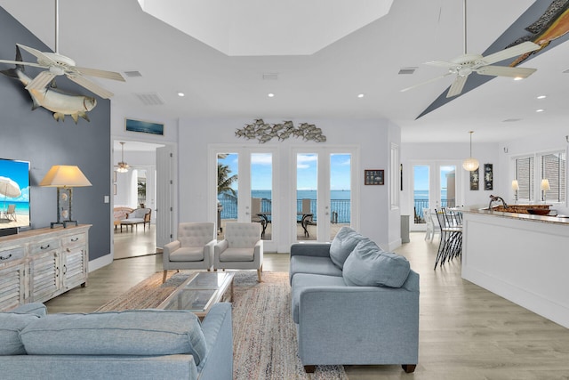 23 S Kyle Way, Marathon, FL 33050 - living room featuring a water view, light wood-type flooring, and ceiling fan