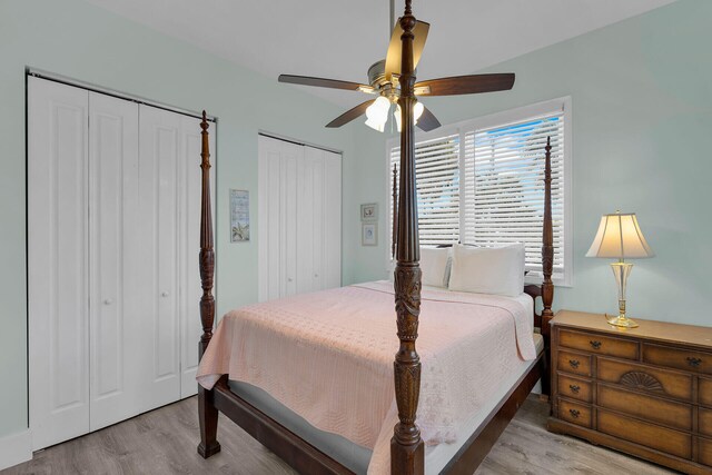 23 S Kyle Way, Marathon, FL 33050 - bedroom featuring ceiling fan, multiple closets, and light wood-type flooring