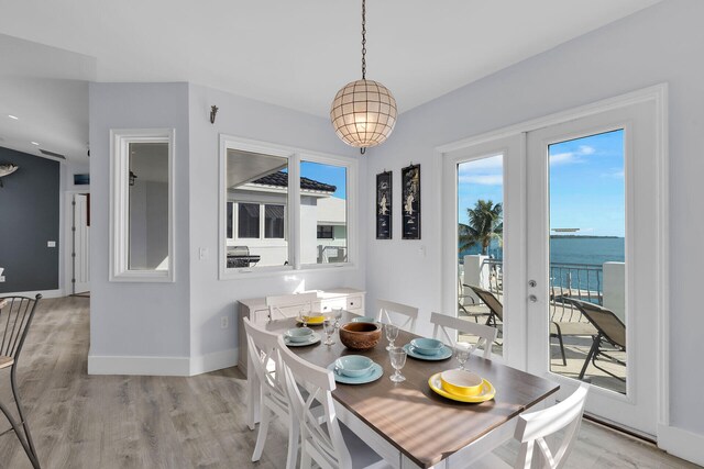23 S Kyle Way, Marathon, FL 33050 - dining space with a water view, light hardwood / wood-style flooring, and french doors