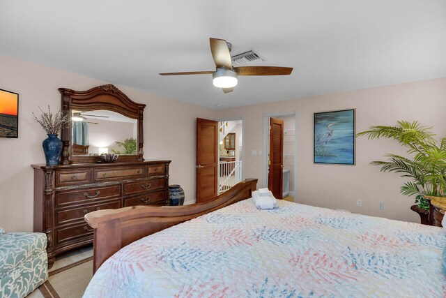 bedroom featuring ceiling fan and light colored carpet