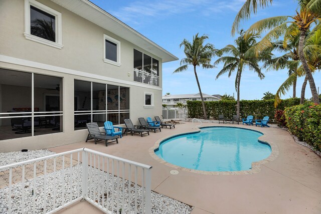 view of swimming pool with a patio