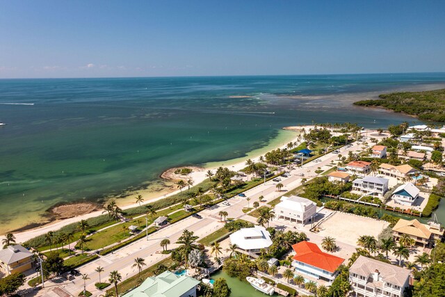 bird's eye view with a beach view and a water view