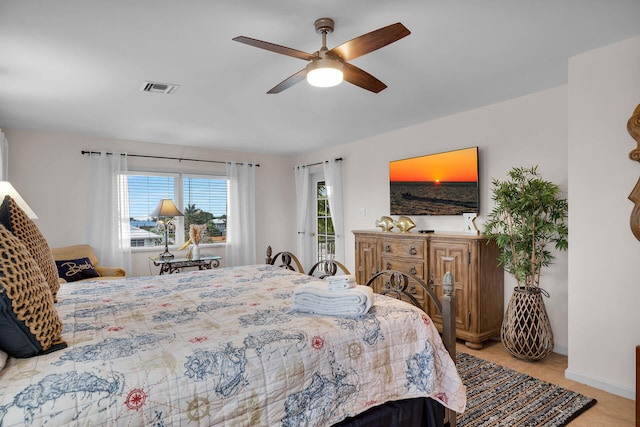 bedroom featuring access to exterior and ceiling fan