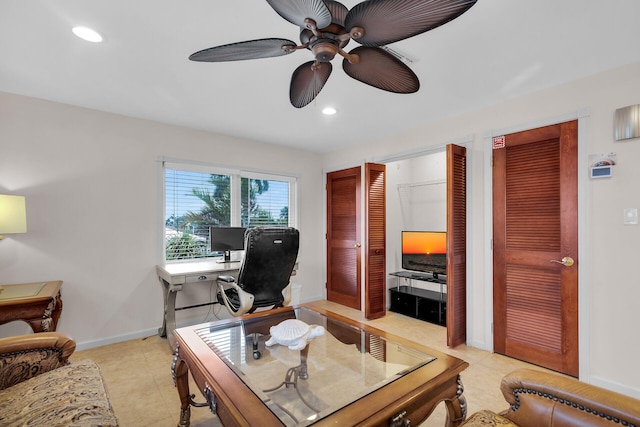 office with ceiling fan and light tile patterned floors