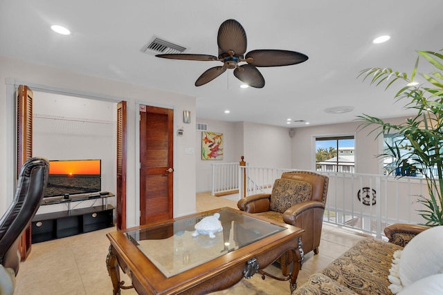 tiled living room featuring ceiling fan