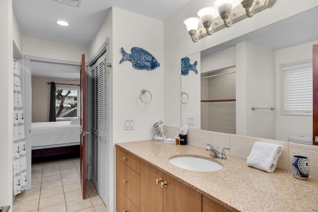 bathroom featuring tile patterned flooring and vanity