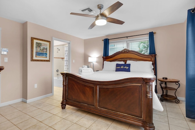 bedroom with connected bathroom, ceiling fan, and light tile patterned flooring