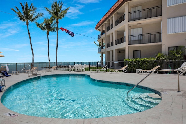 view of swimming pool featuring a patio area