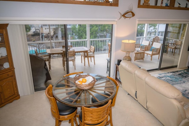 dining area featuring light tile patterned floors