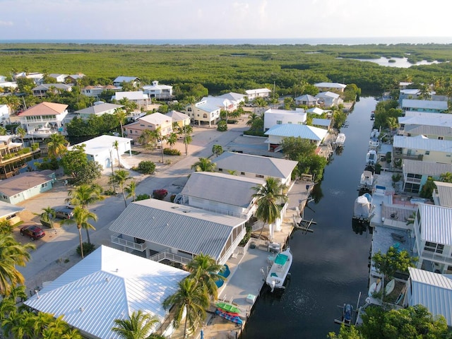 aerial view featuring a water view and a residential view