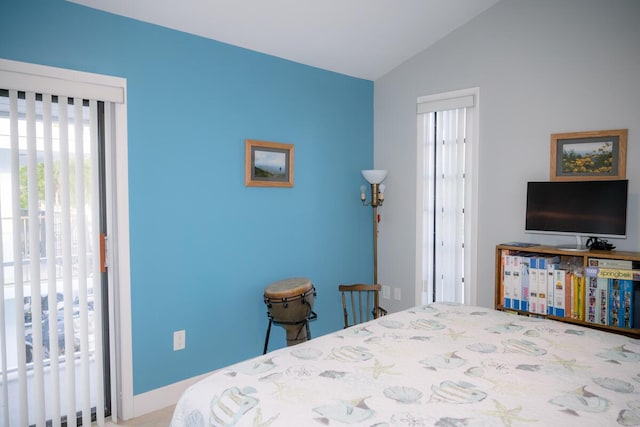 bedroom with lofted ceiling