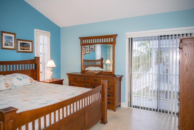 bedroom with access to exterior, light tile patterned floors, and vaulted ceiling