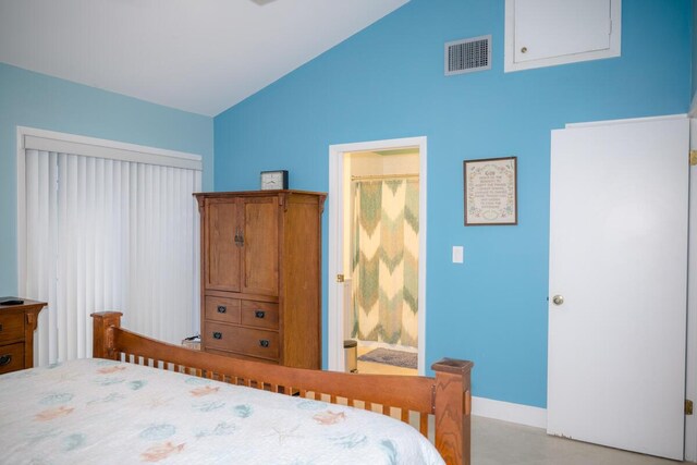 bedroom with vaulted ceiling, visible vents, and baseboards