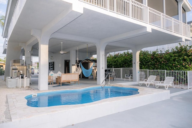 view of swimming pool with a fenced in pool, a patio area, ceiling fan, and fence
