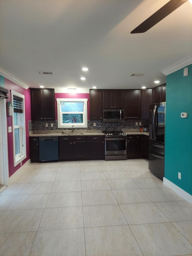 kitchen with sink, crown molding, tasteful backsplash, black appliances, and light tile patterned flooring