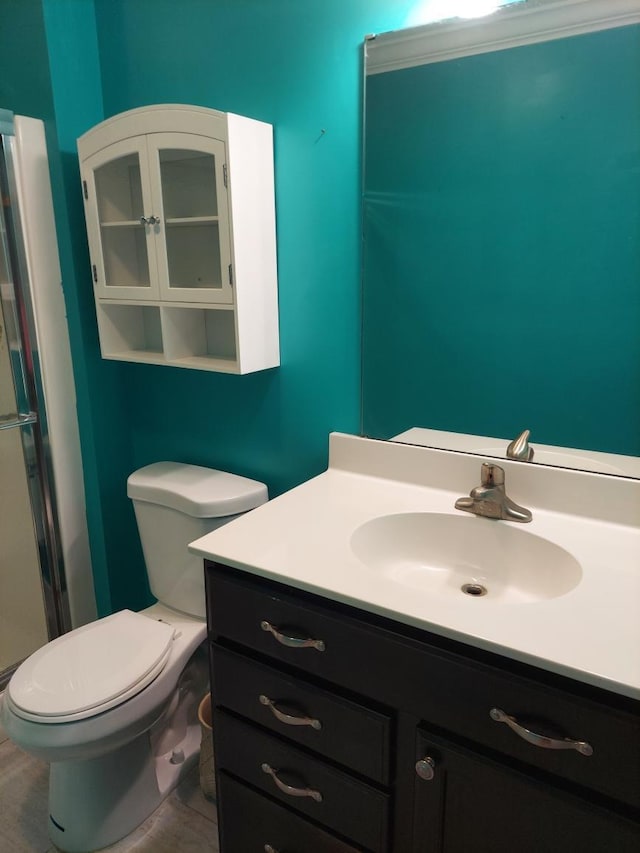 bathroom featuring vanity, toilet, and hardwood / wood-style floors