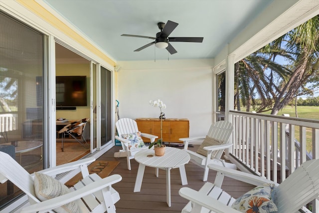 sunroom with a ceiling fan