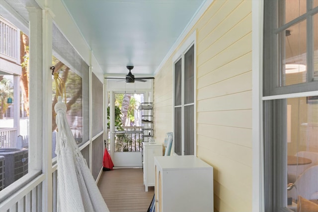 sunroom with a ceiling fan