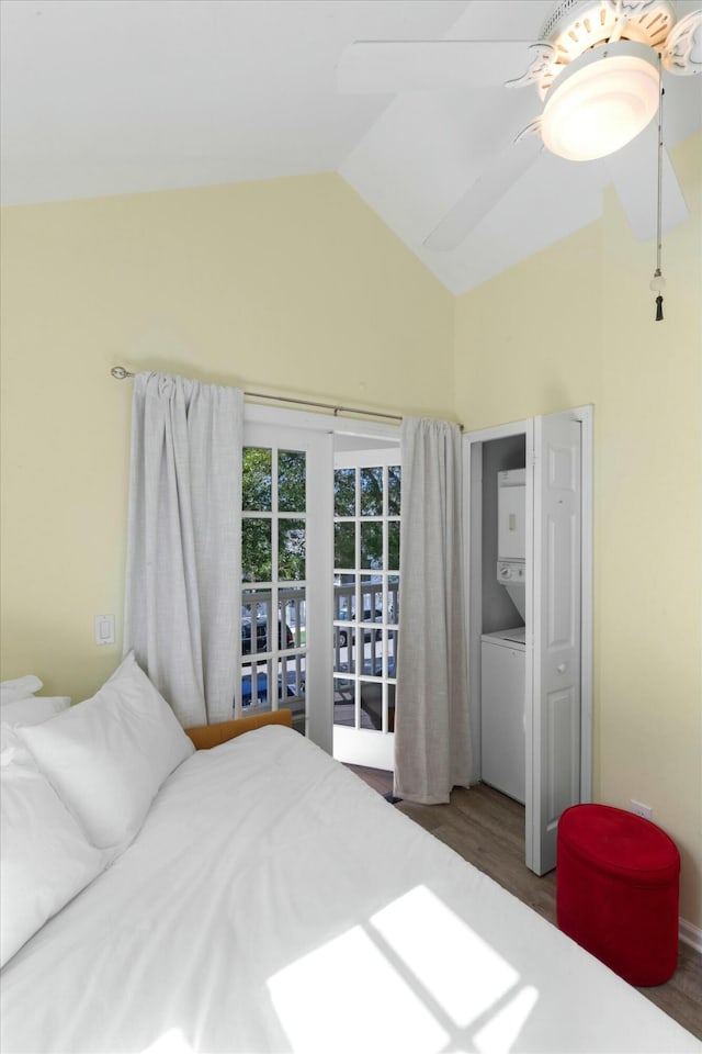 bedroom with a ceiling fan, lofted ceiling, and wood finished floors