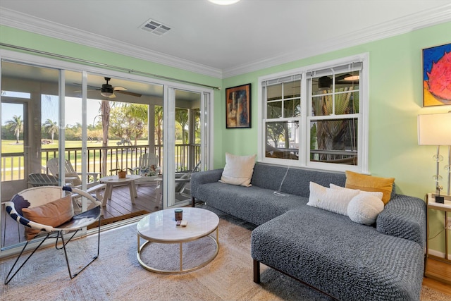 sunroom with visible vents and ceiling fan