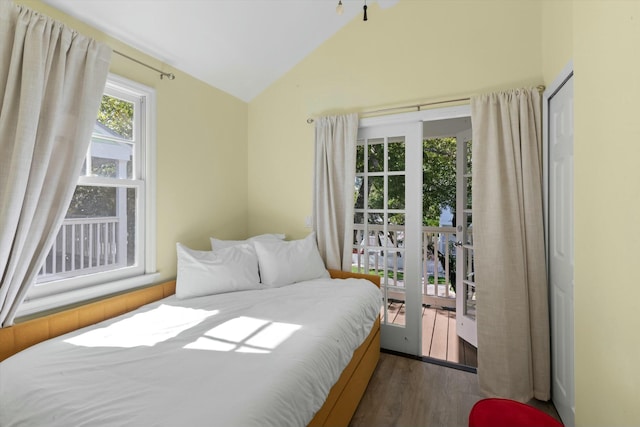 bedroom featuring vaulted ceiling and wood finished floors