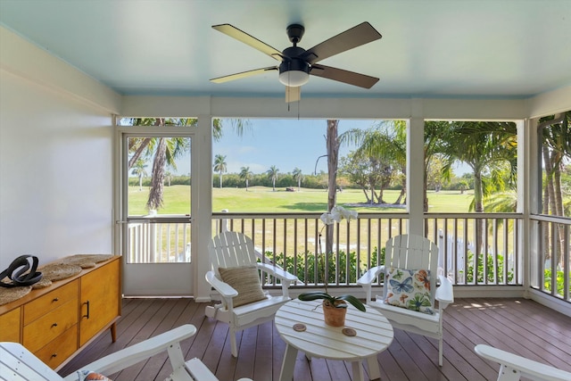 sunroom / solarium with plenty of natural light and a ceiling fan