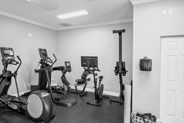 workout area with crown molding and baseboards