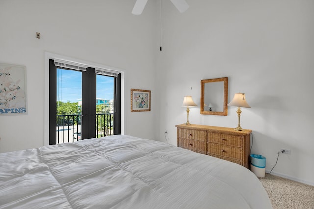 carpeted bedroom featuring access to outside, baseboards, and a ceiling fan