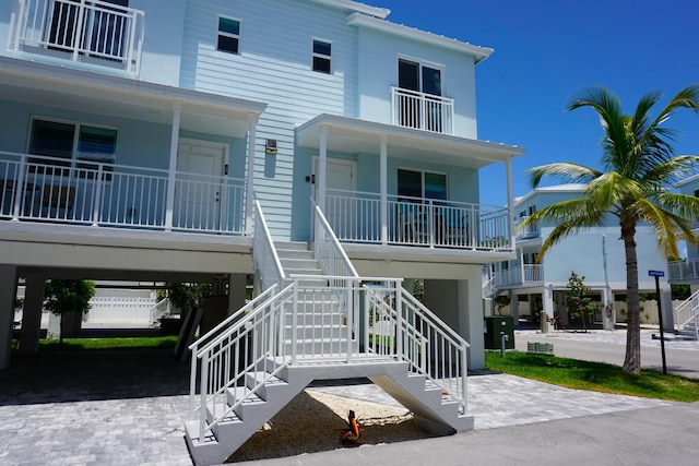 exterior space with a carport and a porch