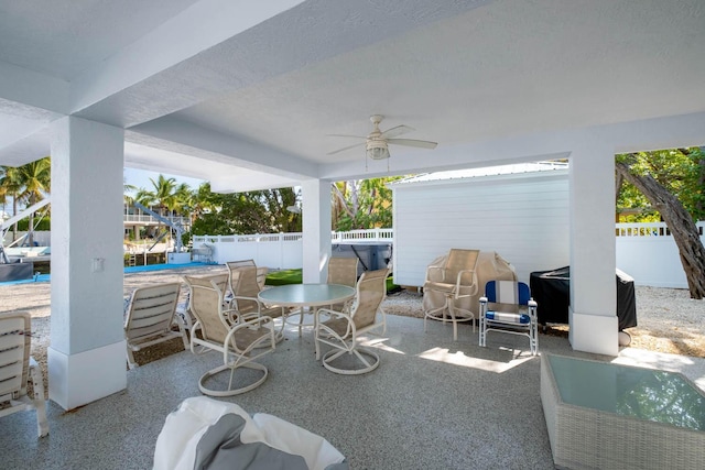 view of patio / terrace featuring ceiling fan, a fenced backyard, outdoor dining space, an outdoor pool, and area for grilling