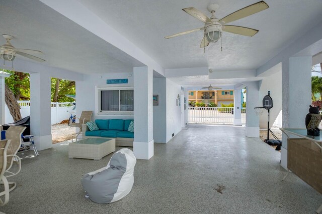 view of patio / terrace with an outdoor hangout area, ceiling fan, and fence