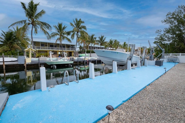 exterior space with a water view and boat lift
