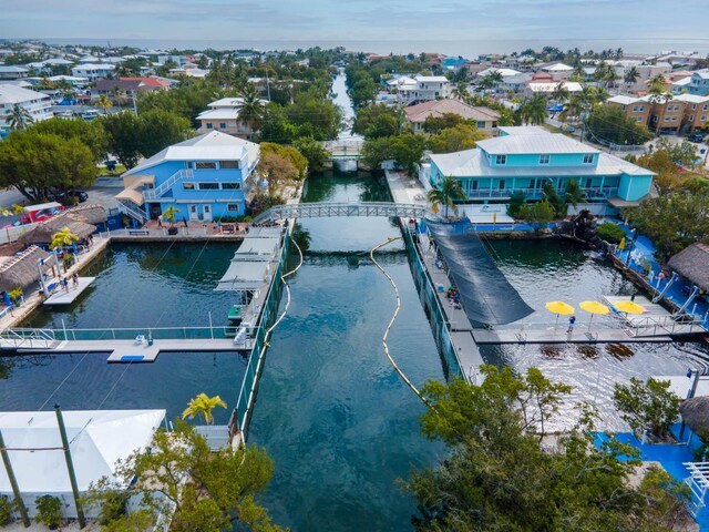 aerial view with a water view and a residential view